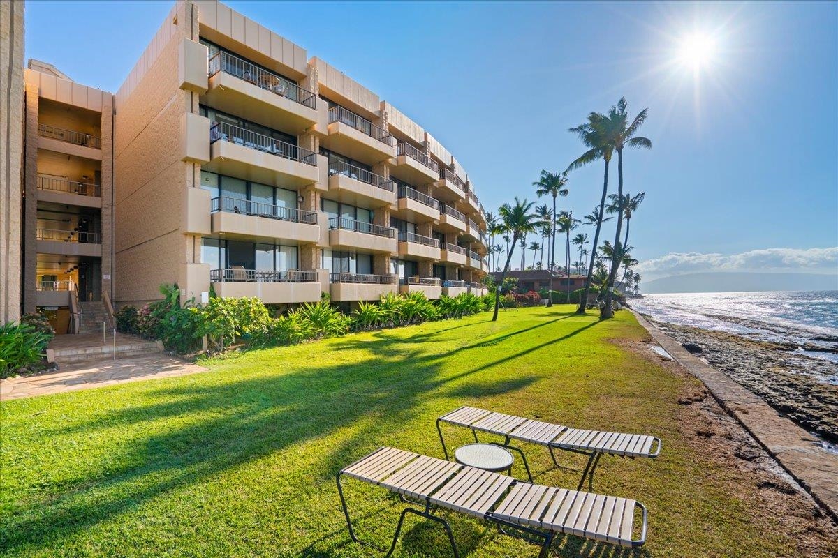 3601 Lower Honoapiilani Road, Unit 201 Lahaina, HI 96761 - Photo 31 of 37 a view of a house with a swimming pool