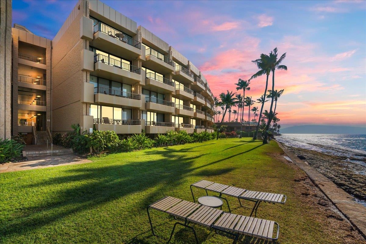 3601 Lower Honoapiilani Road, Unit 201 Lahaina, HI 96761 - Photo 32 of 37 a view of a building with a yard
