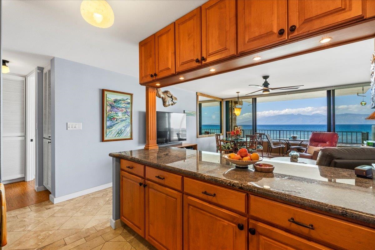 3601 Lower Honoapiilani Road, Unit 201 Lahaina, HI 96761 - Photo 4 of 37 a kitchen with stainless steel appliances granite countertop a sink and a counter space