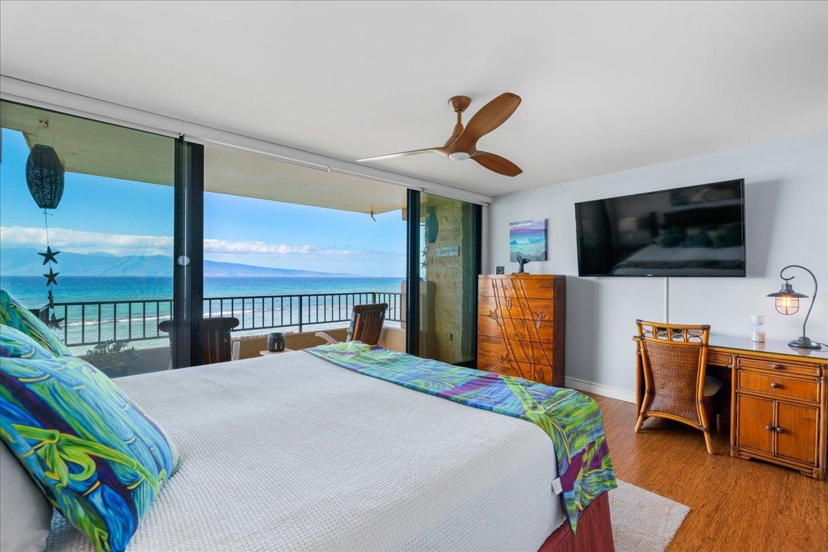 3601 Lower Honoapiilani Road, Unit 201 Lahaina, HI 96761 - Photo 7 of 37 a bedroom with a bed and a flat screen tv