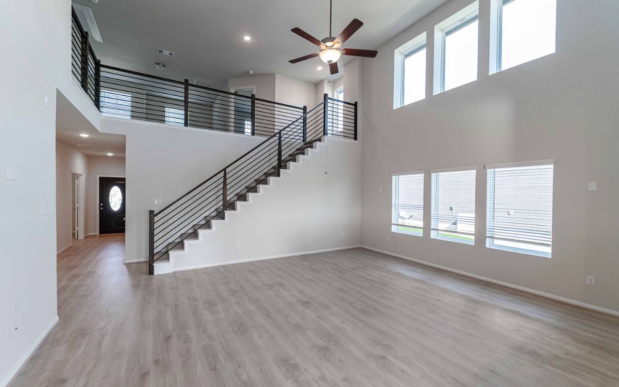 224 Denali Drive Kyle, TX 78640 - Photo 5 of 18 wooden floor in an empty room with a window
