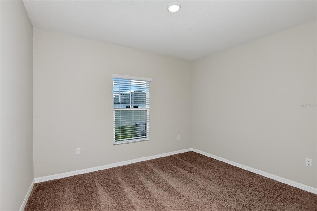 4385 Prairie Run Haines City, FL 33844 - Photo 14 of 25 an empty room with a window