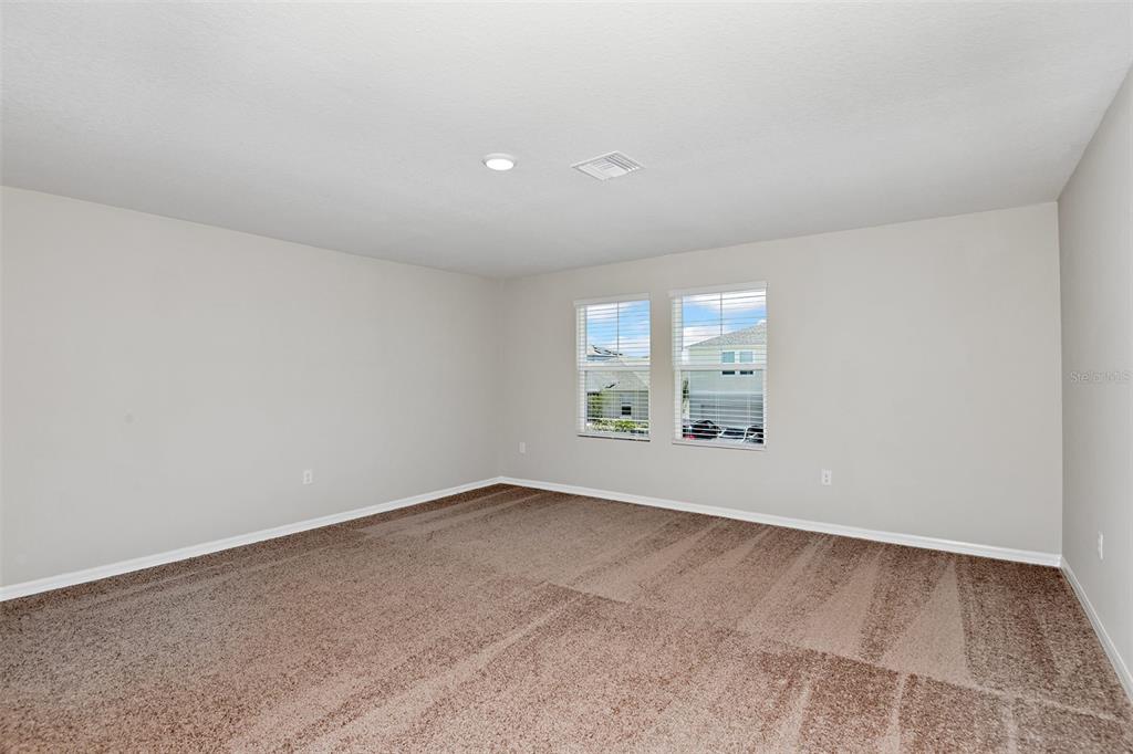 4385 Prairie Run Haines City, FL 33844 - Photo 16 of 25 an empty room with windows