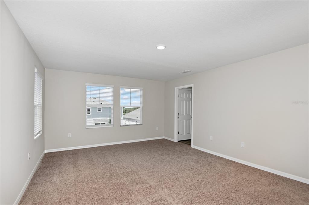 4385 Prairie Run Haines City, FL 33844 - Photo 18 of 25 an empty room with windows