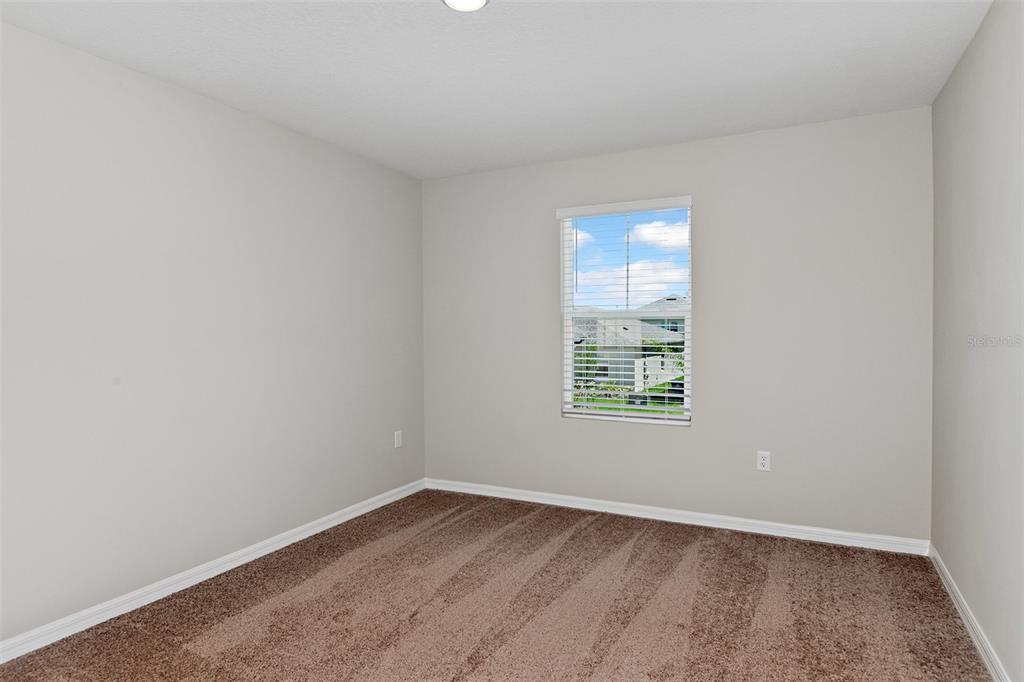 4385 Prairie Run Haines City, FL 33844 - Photo 22 of 25 an empty room with a window