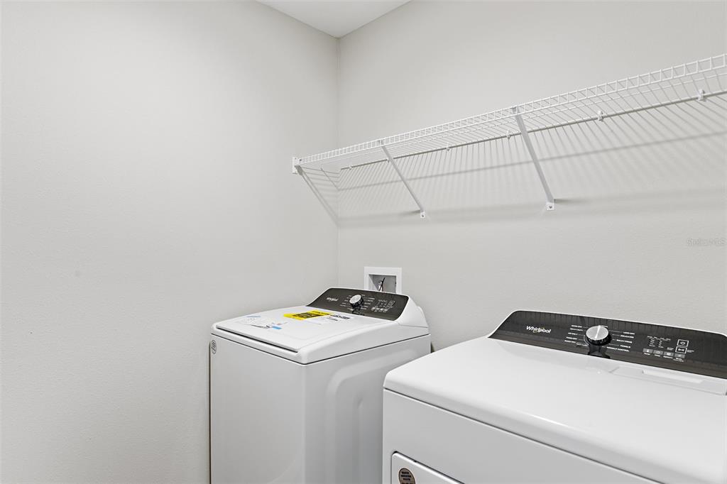 4385 Prairie Run Haines City, FL 33844 - Photo 25 of 25 a utility room with dryer and washer