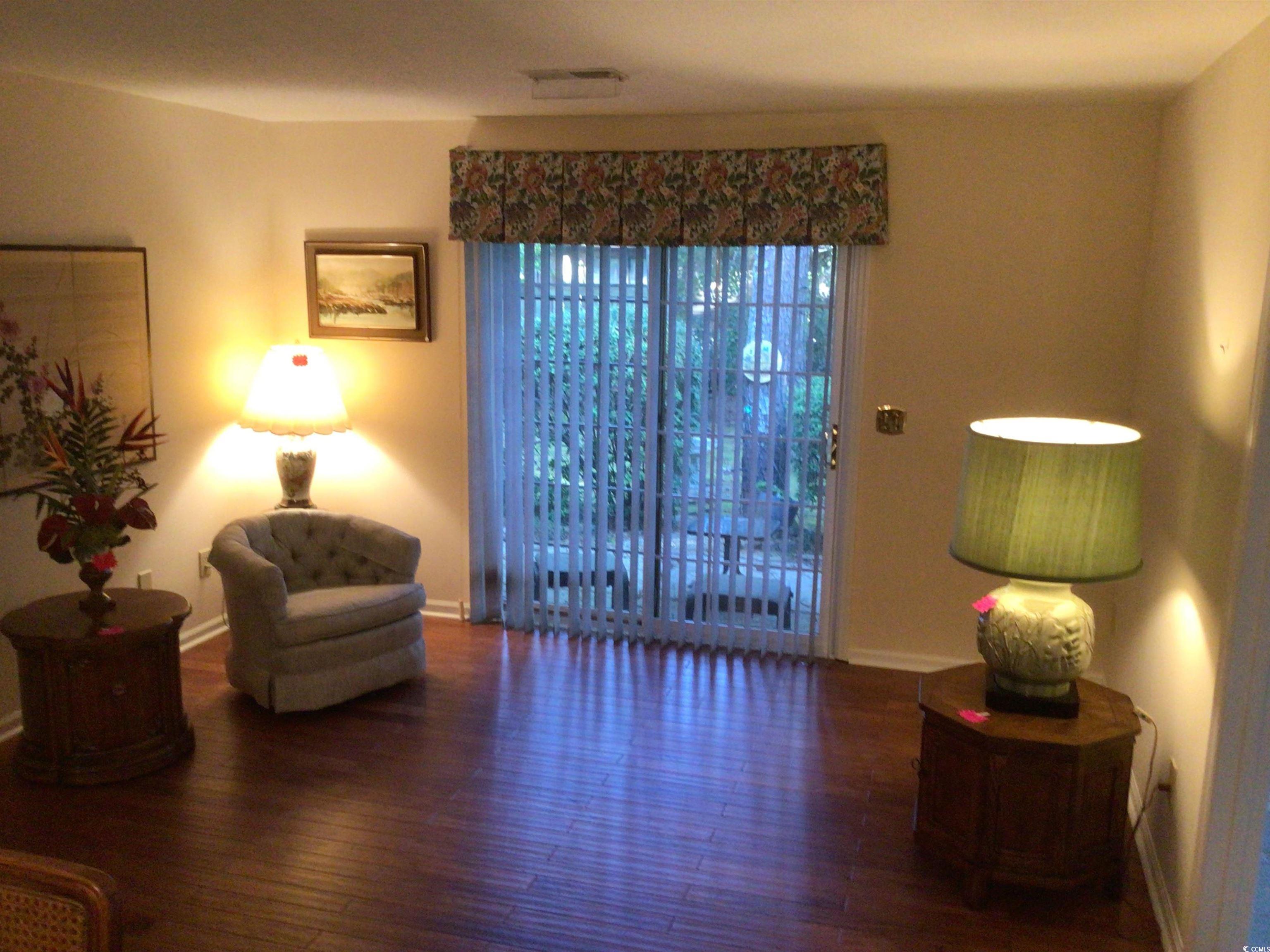 107 Myrtle Trace Drive Conway, SC 29526 - Photo 16 of 31 Living area with wood finished floors and baseboards