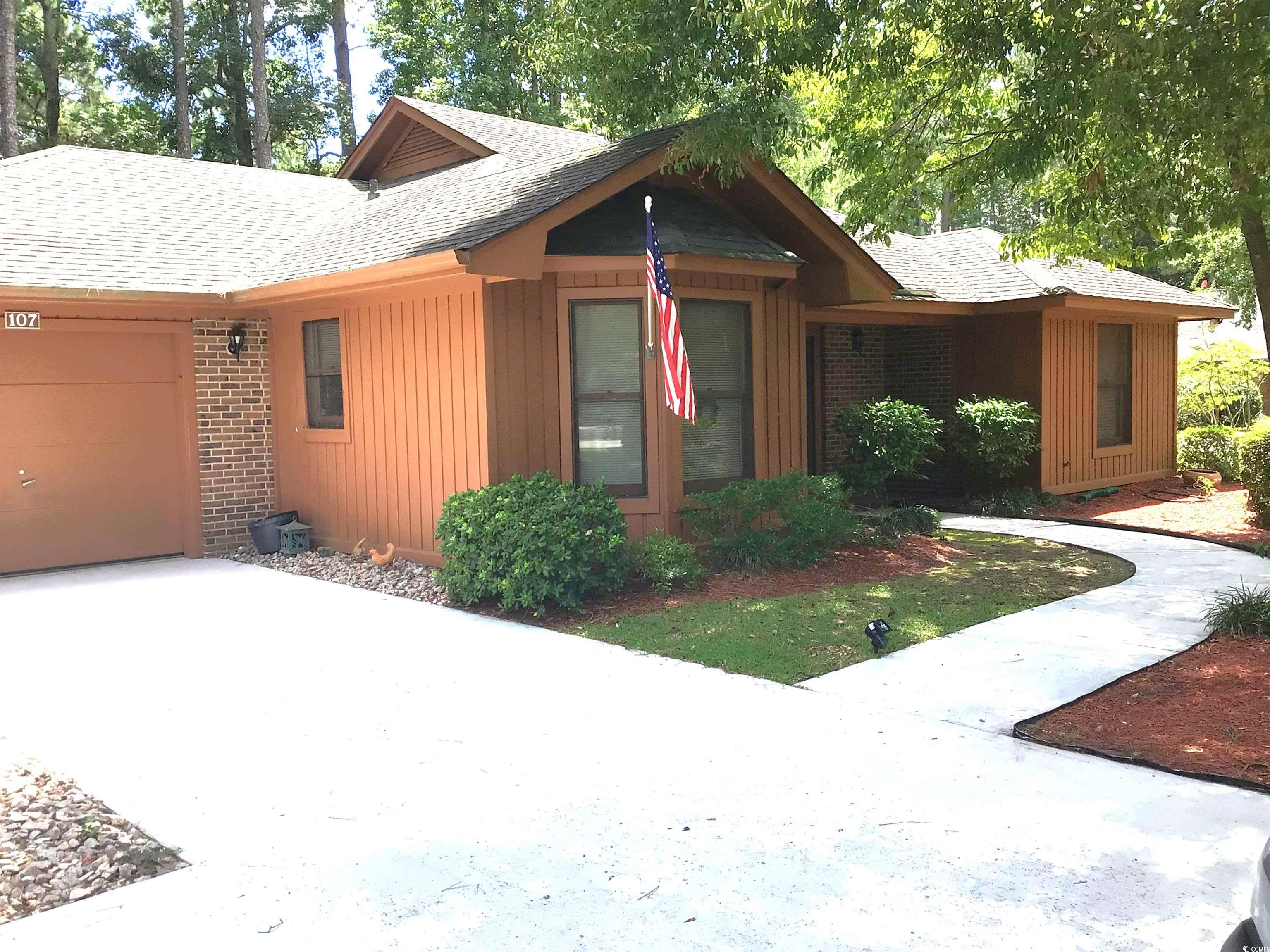 107 Myrtle Trace Drive Conway, SC 29526 - Photo 3 of 31 View of front of house with brick siding, roof with shingles, and an attached garage