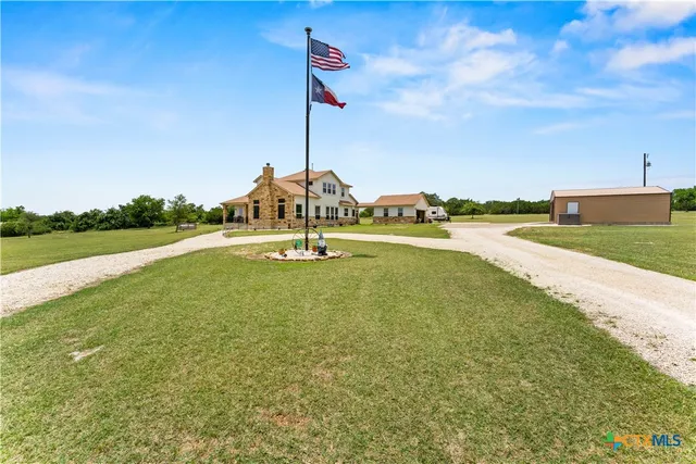 a view of a swimming pool and a yard