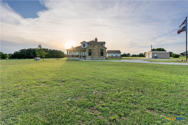 a view of a building with a big yard