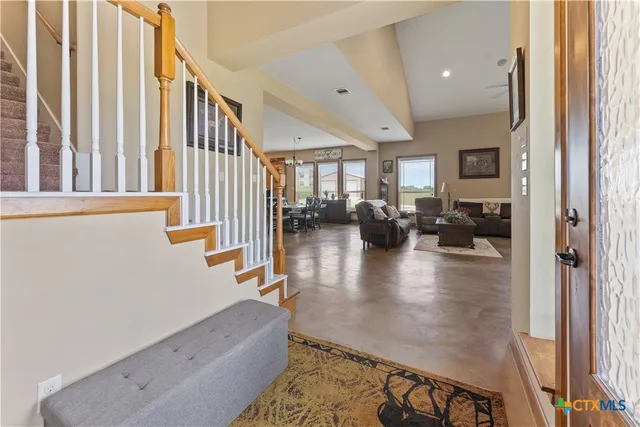 wooden floor with a view of living room with furniture