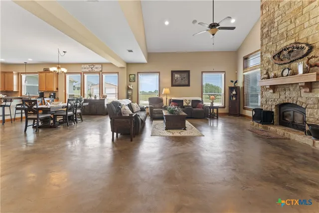 a living room with fireplace furniture and a fireplace