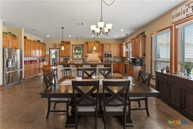 a view of a dining area with furniture window and outside view