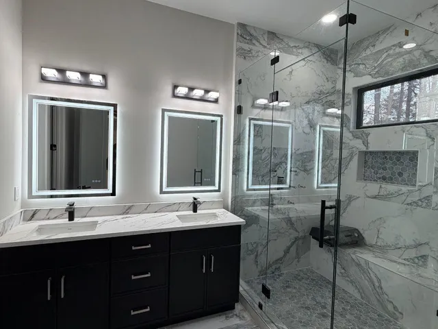 a bathroom with a double vanity sink mirror and double