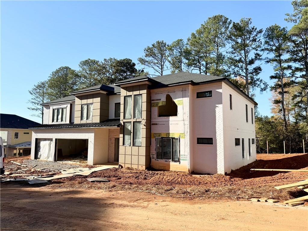 2701 Collins Hill Road Lawrenceville, GA 30043 - Photo 3 of 67 a front view of a house with a yard