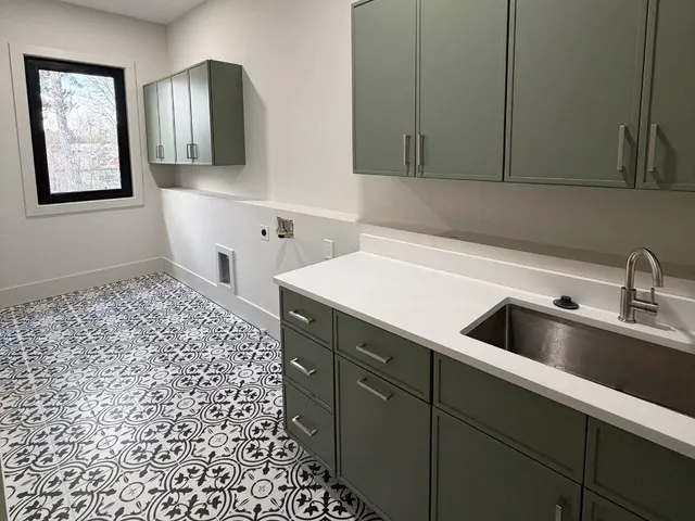 a kitchen with a sink and cabinets