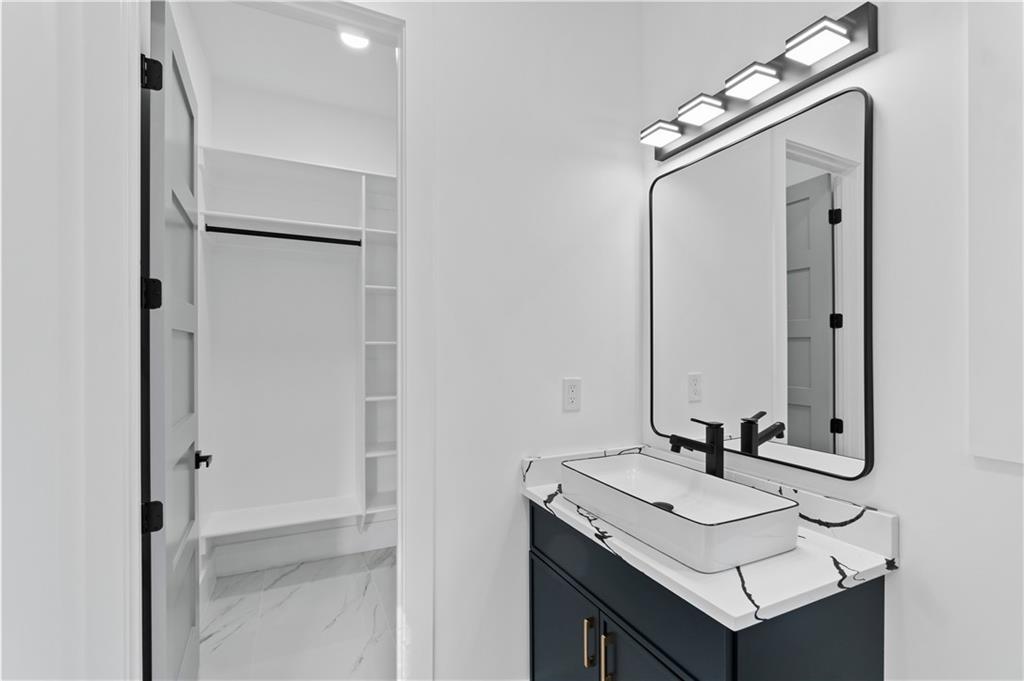 2701 Collins Hill Road Lawrenceville, GA 30043 - Photo 39 of 67 a bathroom with a sink and a mirror
