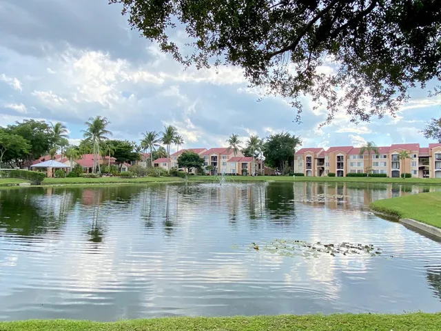 a view of a lake with houses in the back
