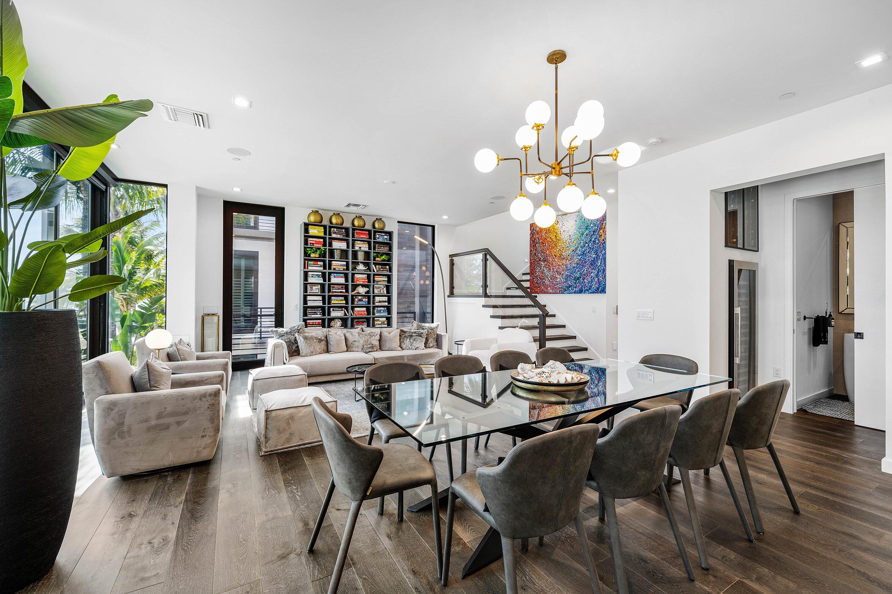 11501 Old Ocean Boulevard Ocean Ridge, FL 33435 - Photo 29 of 70 a view of a dining room with furniture and a chandelier