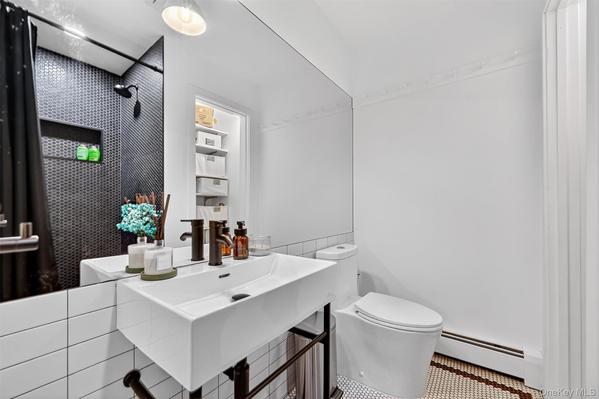16 Oxford Springs Road Chester, NY 10918 - Photo 20 of 48 a bathroom with a sink toilet and mirror