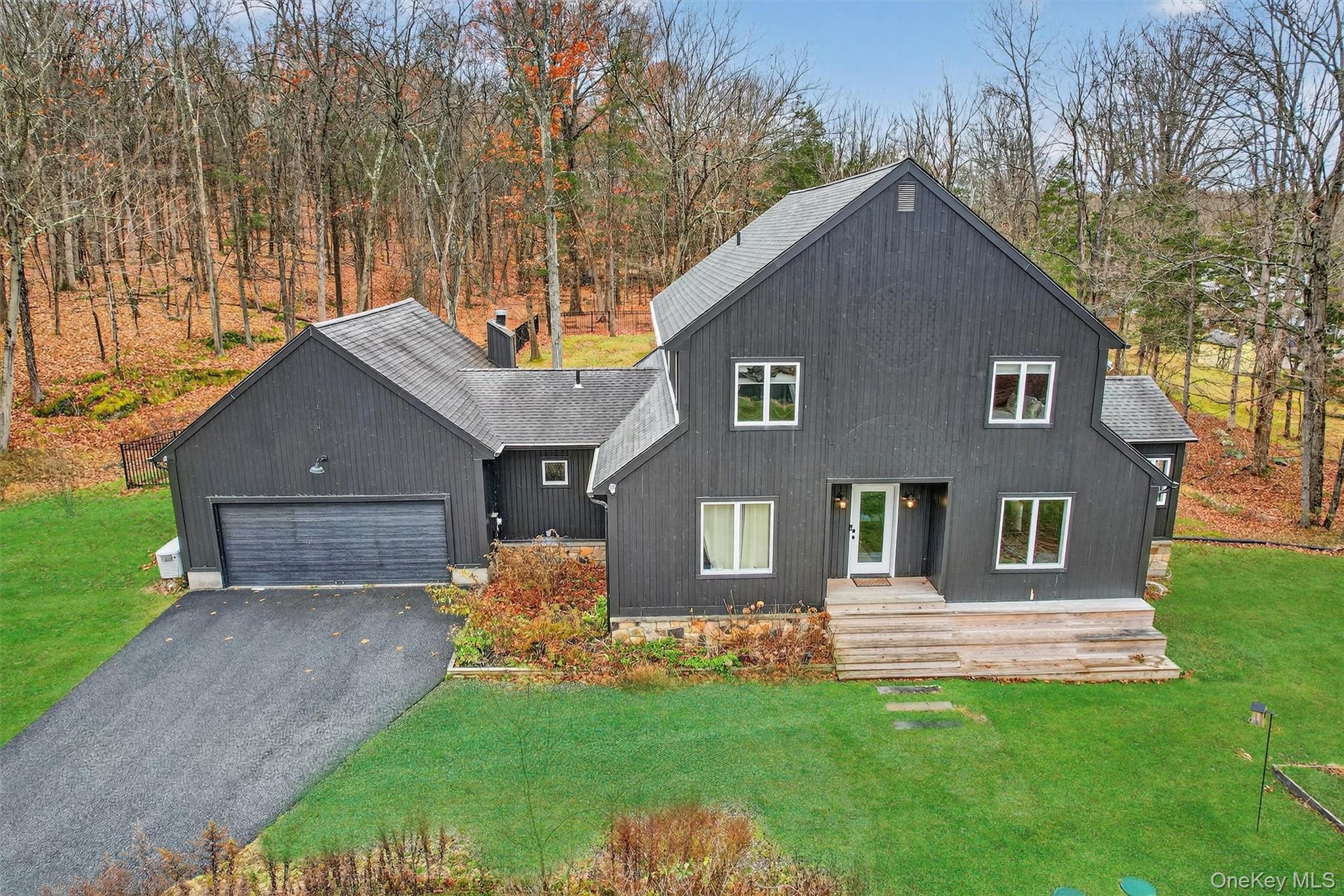16 Oxford Springs Road Chester, NY 10918 - Photo 2 of 48 a front view of a house with a yard and garage
