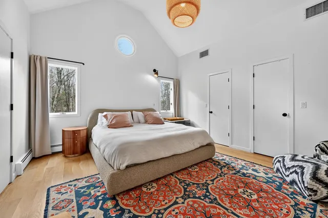 a bedroom with a bed and a cabinets