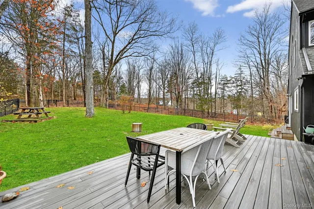 a view of a wooden deck and a patio