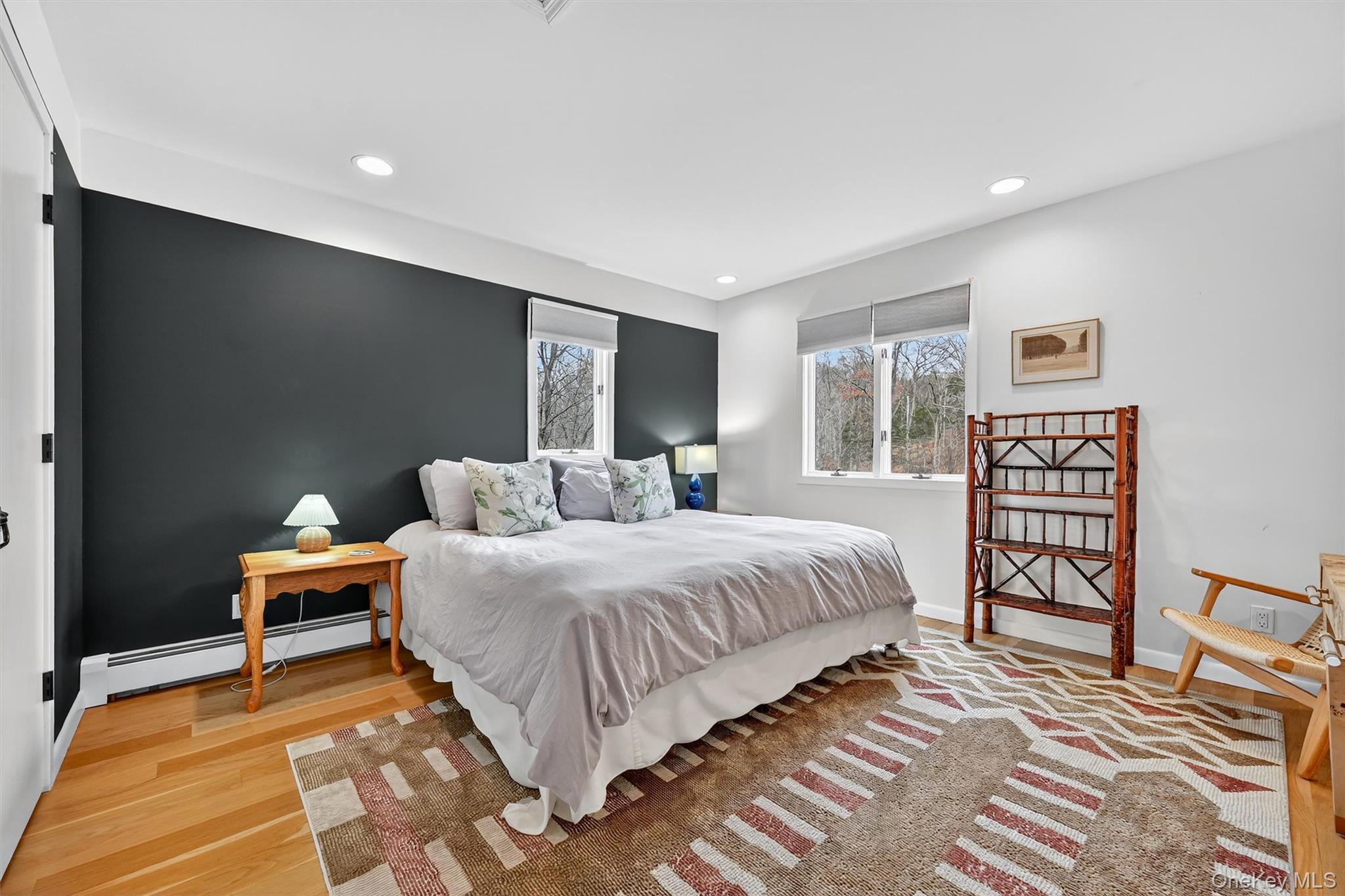 16 Oxford Springs Road Chester, NY 10918 - Photo 31 of 48 a spacious bedroom with a bed and wooden floor