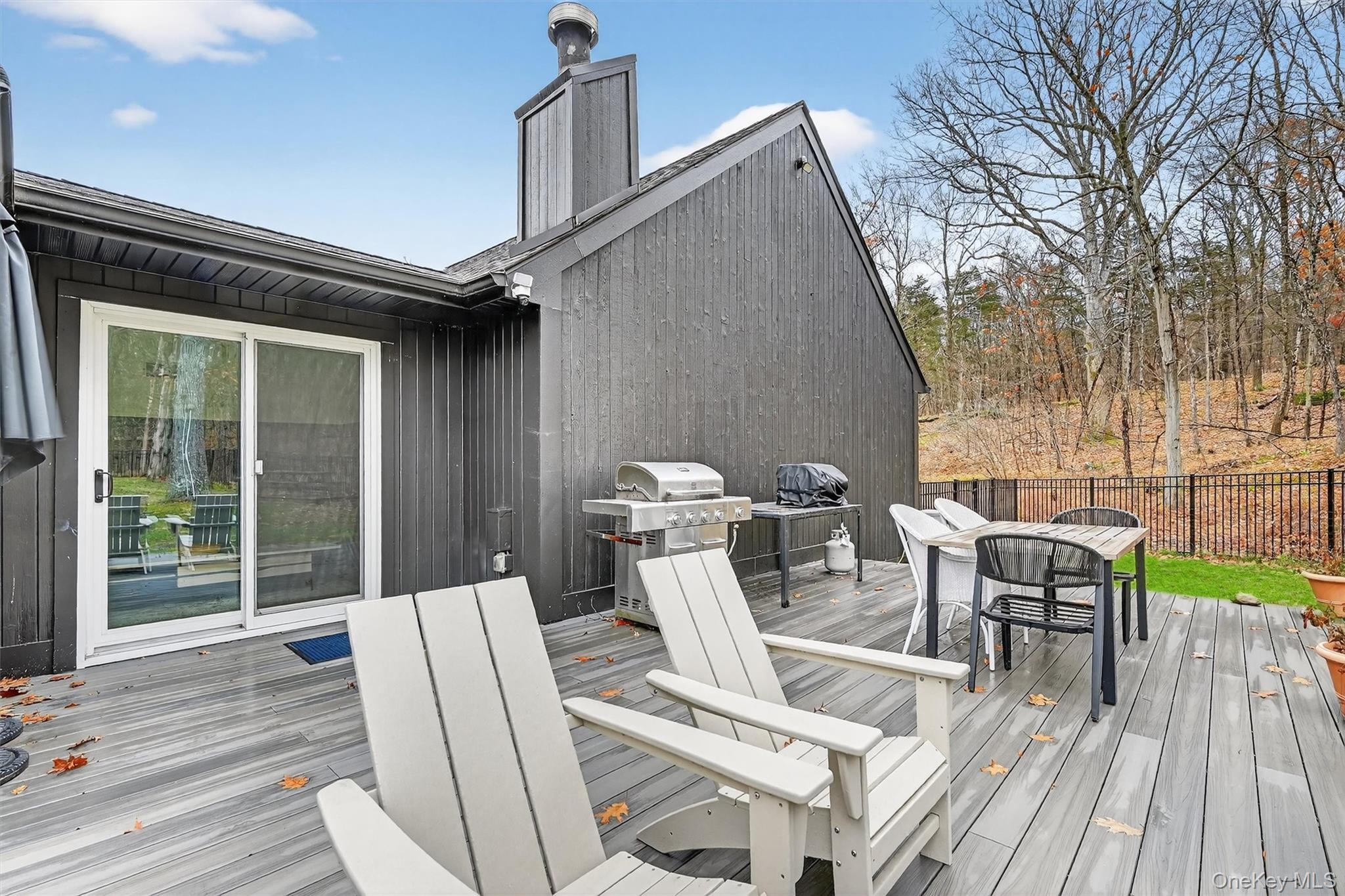 16 Oxford Springs Road Chester, NY 10918 - Photo 34 of 48 a view of a chairs and table in patio with wooden floor