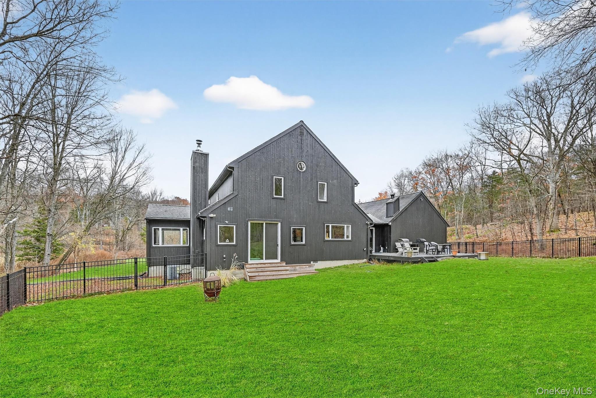 16 Oxford Springs Road Chester, NY 10918 - Photo 35 of 48 a front view of a house with a yard and trees