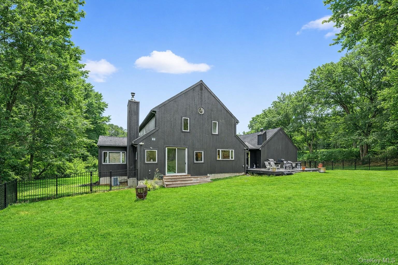 16 Oxford Springs Road Chester, NY 10918 - Photo 36 of 43 a front view of a house with a yard porch and green space