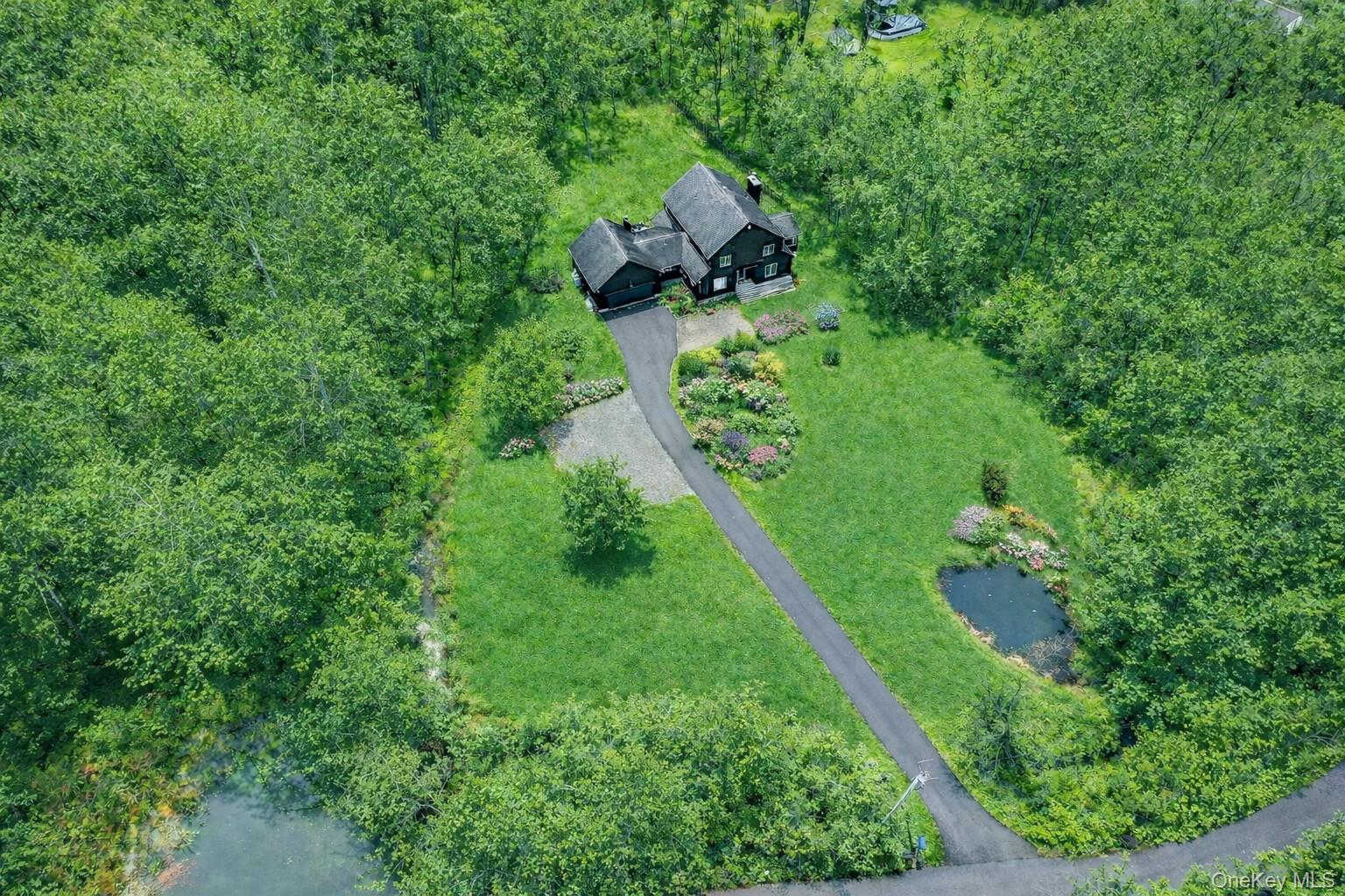 16 Oxford Springs Road Chester, NY 10918 - Photo 39 of 43 a backyard of a house with lots of green space