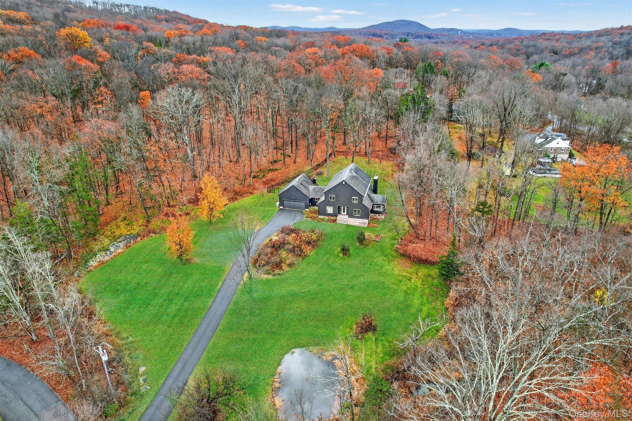 16 Oxford Springs Road Chester, NY 10918 - Photo 4 of 48 a aerial view of a golf course with parking space