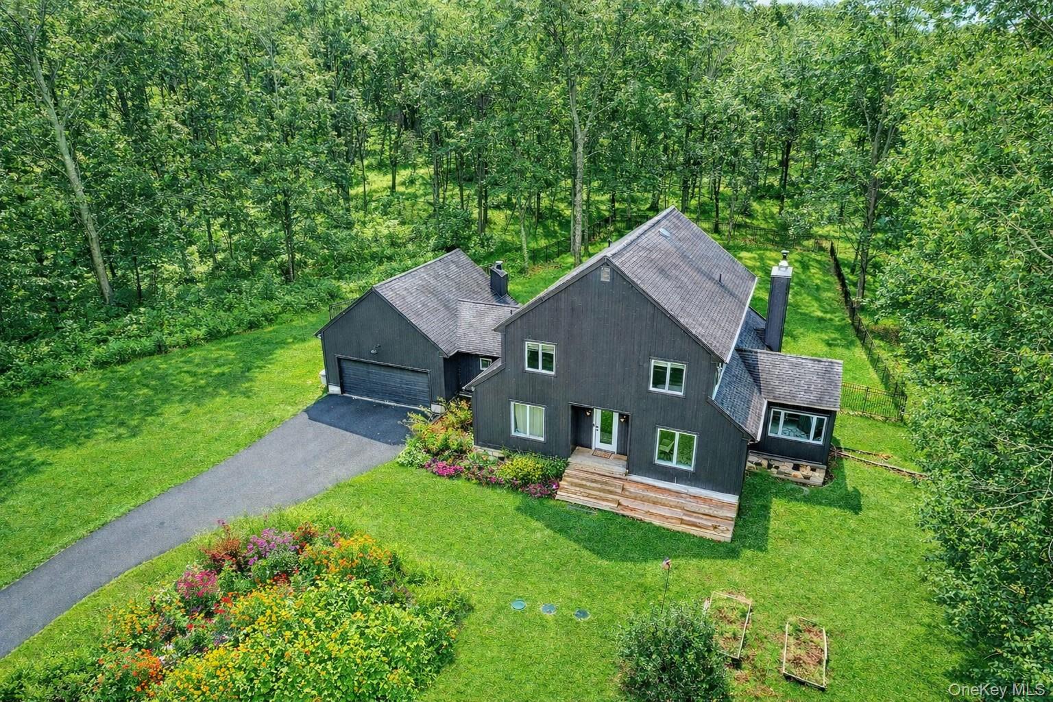 16 Oxford Springs Road Chester, NY 10918 - Photo 4 of 43 a view of a house with a big yard plants and large trees