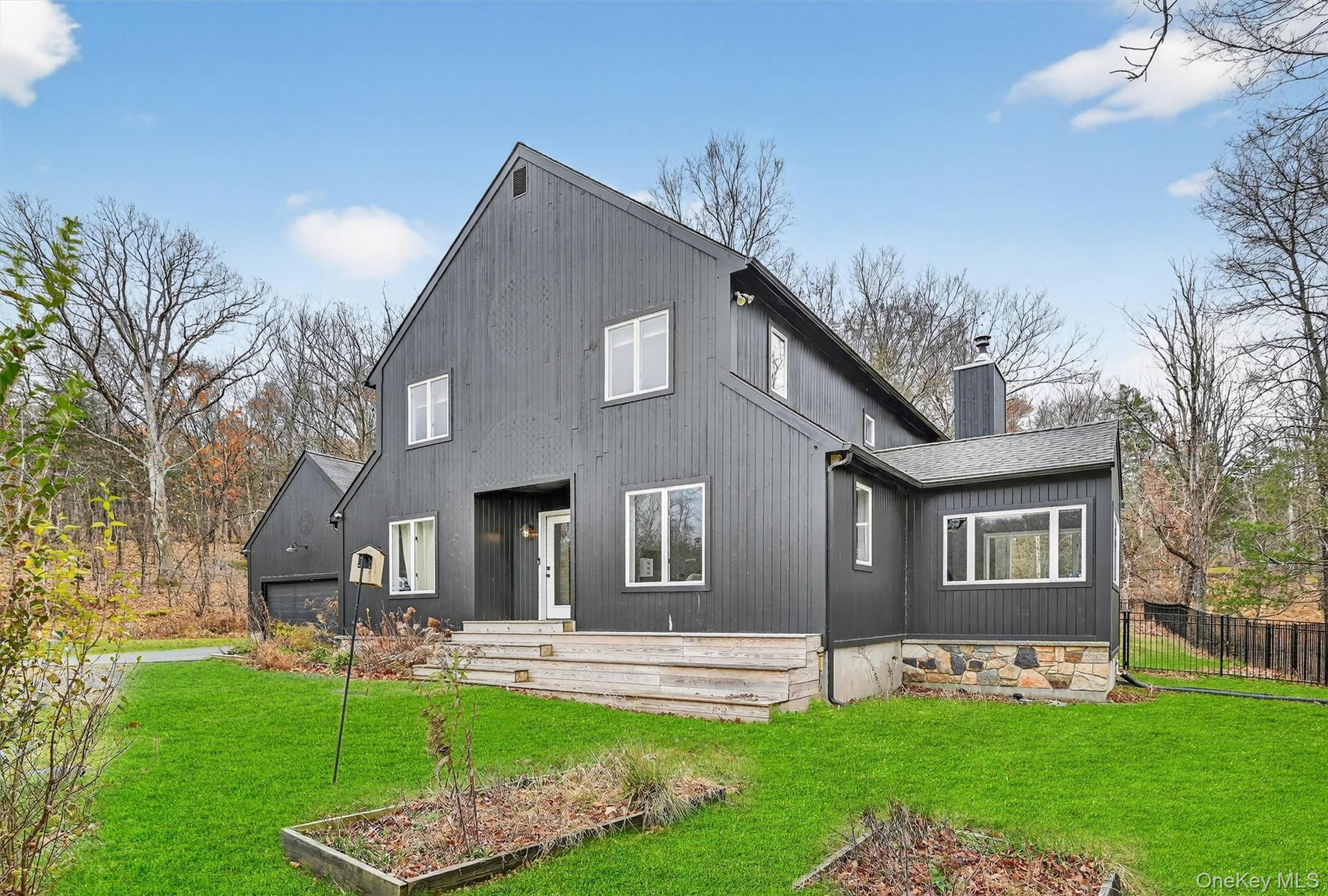 16 Oxford Springs Road Chester, NY 10918 - Photo 45 of 48 a front view of a house with a yard and garage