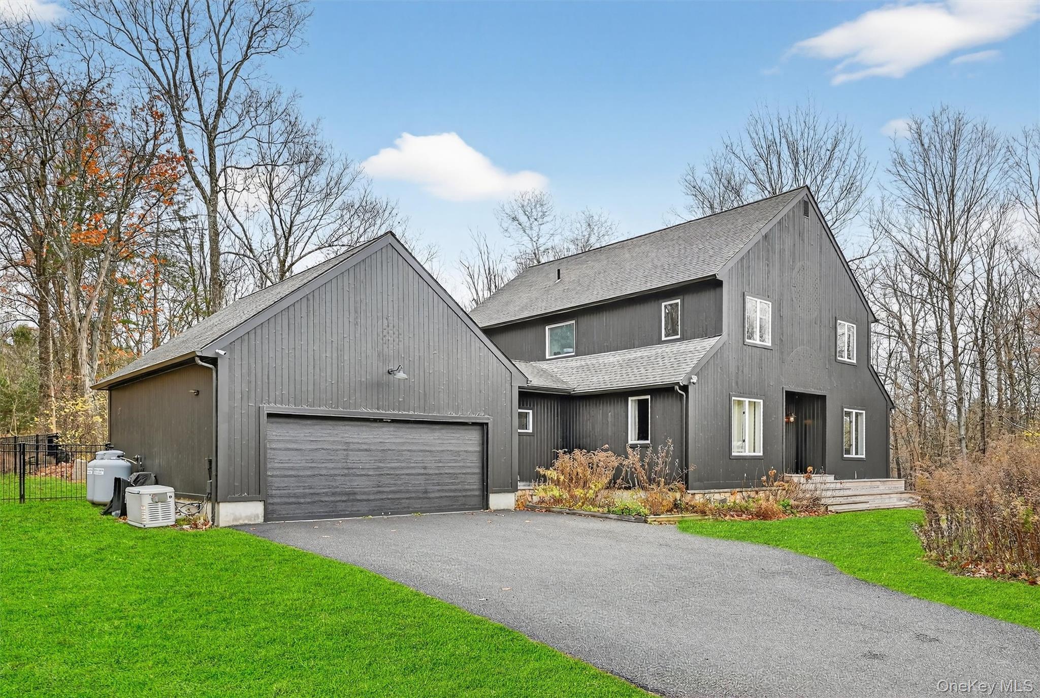 16 Oxford Springs Road Chester, NY 10918 - Photo 46 of 48 a front view of a house with a garden and yard