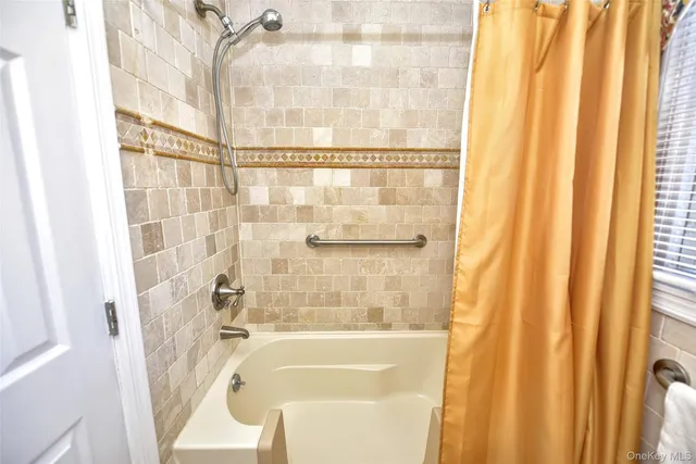 a bathroom with a sink vanity mirror and toilet