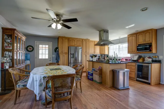a view of a tables and chairs under an umbrella