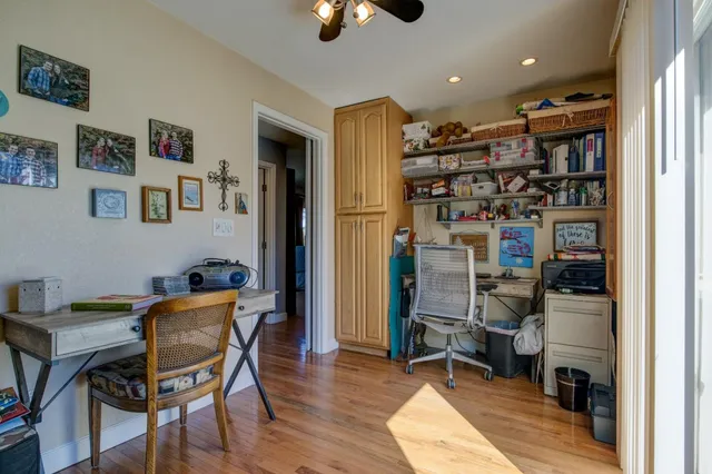 a front view of a house with a yard covered with snow