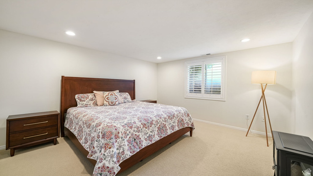 11128 South Barrett Pk Circle Sandy, UT 84092 - Photo 24 of 36 Spacious room featuring neutral carpet flooring, recessed ceiling lighting, and a window with white plantation shutters