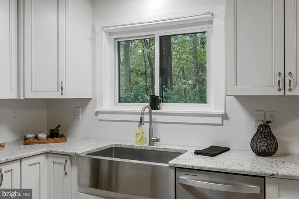 a kitchen with a sink and cabinets