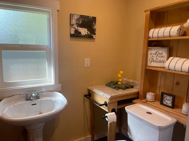 a bathroom with a sink and mirror