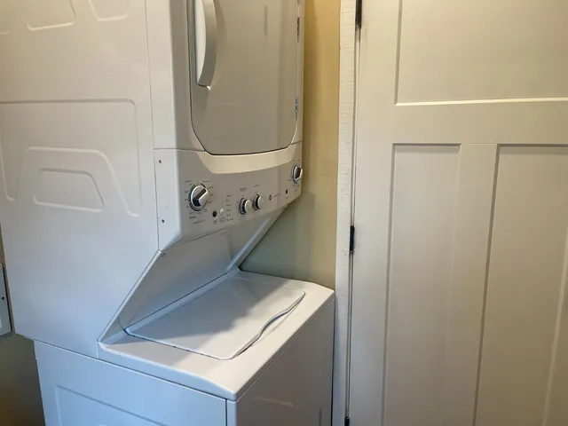 a bathroom with a shower and a window