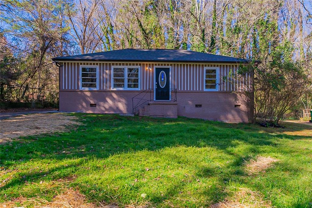 1387 Cobb Branch Drive Decatur, GA 30032 - Photo 1 of 1 a front view of house with yard and green space
