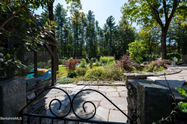 a kitchen with a sink and a stove top oven