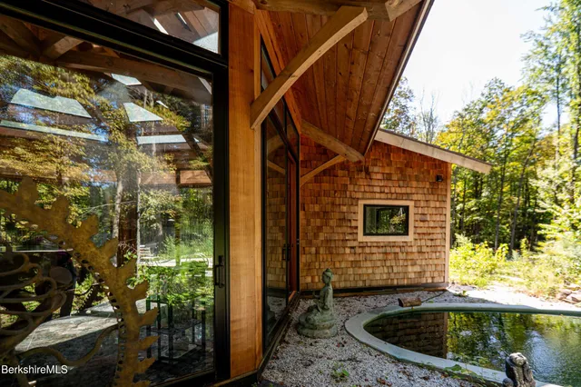 a kitchen with stainless steel appliances granite countertop wooden cabinets and a refrigerator