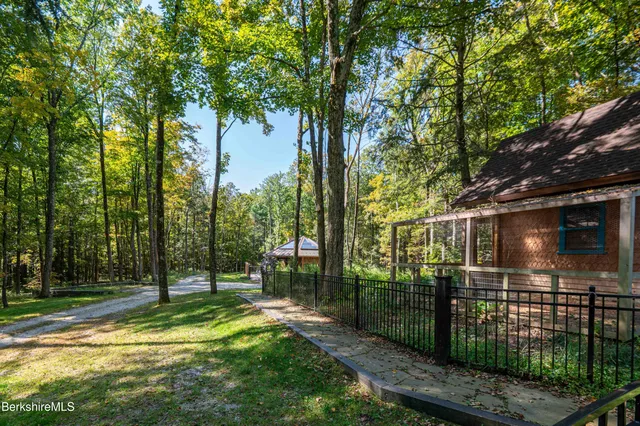 a kitchen with stainless steel appliances a table chairs and a refrigerator