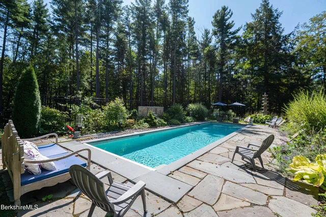 a view of a chairs and table in the garden