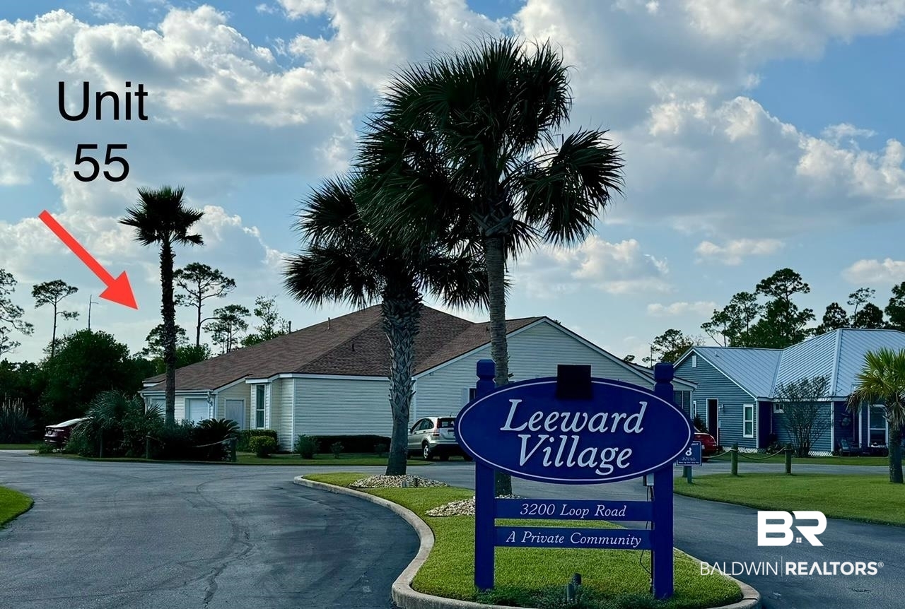 3200 Loop Road, Unit 55 Orange Beach, AL 36561 - Photo 36 of 40 Community / neighborhood sign featuring a lawn