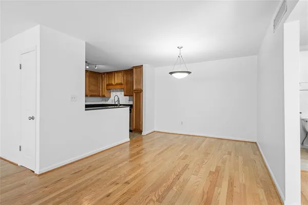 a view of a kitchen with wooden floor